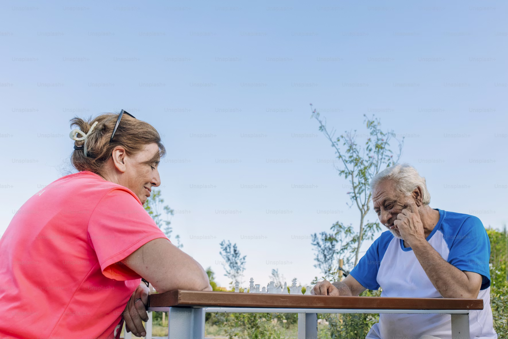 Person reflecting quietly with a journal in a calm indoor setting.